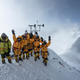 At 8,430 meters above sea level, the high-altitude expedition team celebrates after setting upthe world’s highest operating automated weather station during National Geographic andRolex’s 2019 Perpetual Planet Extreme Expedition to Mt. Everest.